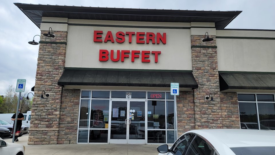 Bright buffet line with many Asian staples.
