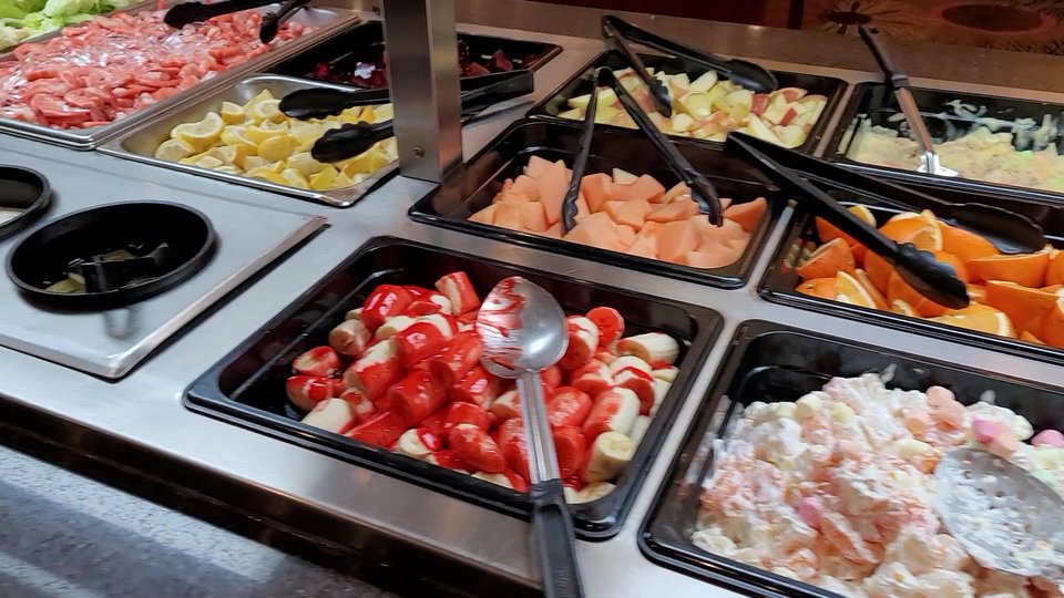 Sushi rolls arranged on a display counter.